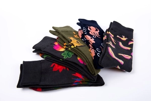 Close-up of animal and floral pattern mid-calf cotton socks with ribbed cuffs