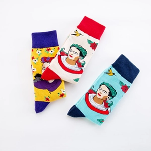 Artistic Frida Kahlo portrait crew socks with floral patterns in vibrant multicolor mix