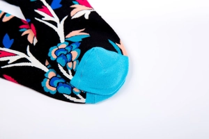 Detailed macro view of high-density cotton knit socks with colorful floral patterns