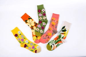 Detail showing five colorful cotton socks with vibrant floral and sunflower patterns