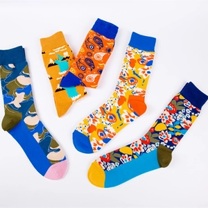 Colorful patterned cotton crew socks featuring camo, landscape, and floral abstract designs