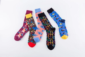 Detailed knit texture of five pairs colorful cotton crew socks with vibrant patterns
