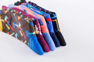 Detail view of colorful patterned crew socks with vibrant prints and knit texture