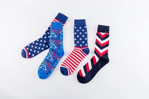 Set of four cotton crew socks with stars, stripes, and geometric patterns in red and blue
