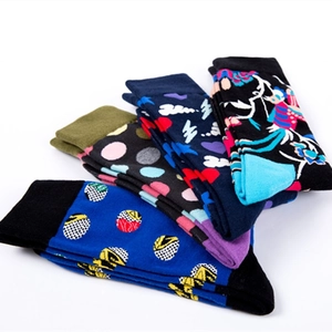 Stack of trendy cotton crew socks featuring vibrant polka dot and floral patterns