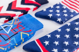 Detailed view of colorful crew socks featuring star patterns and geometric pop designs