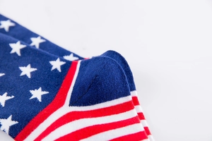 Macro shot of reinforced heel and knit texture on cotton blend American flag socks