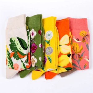 Five pack women cotton crew socks with colorful floral and fruit patterns on white background