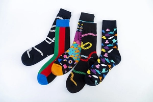 Detailed set of five patterned crew socks featuring colorful geometric and stripe designs