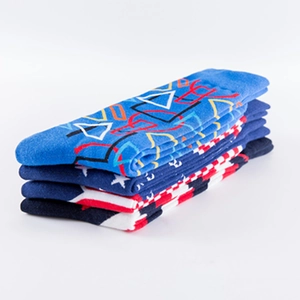Four-pack of colorful cotton crew socks featuring geometric shapes and stars patterns