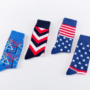 Set of 4 men's cotton blend crew socks featuring colorful geometric and American flag patterns