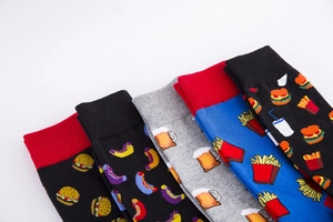 Detail of cotton crew socks featuring colorful fast food patterns like burgers and fries