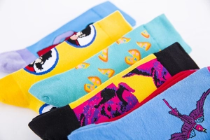 Detail of colorful knitted crew socks featuring Popeye and pizza patterns in a 5-pack