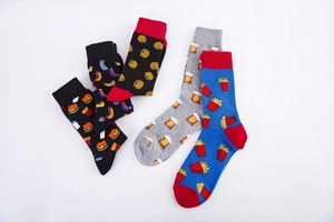 Detailed flat lay of men's cotton socks with creative fast food patterns like burgers and beer