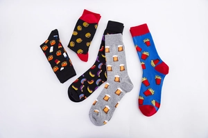 Close-up of colorful cotton socks featuring creative food patterns like burger and fries