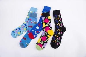 Set of four colorful patterned crew socks featuring geometric, floral, and fish designs