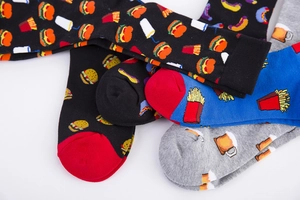 Detail showing colorful food patterns like burger and fries on cotton crew socks