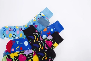 Close-up of colorful cotton crew socks featuring vibrant floral and donut patterns
