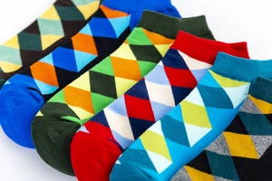 Macro detail of knit texture and colorful argyle pattern on cotton ankle socks
