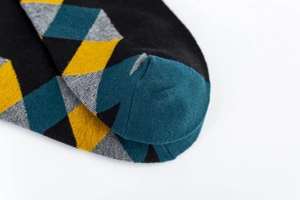 Macro shot of colorful argyle socks toe with high-density jacquard knitting and flat seam