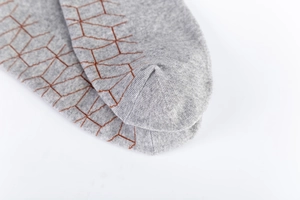 Detailed macro view of high-density cotton knit toes with geometric patterns
