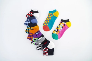 Detail of colorful geometric pattern low-cut cotton socks in a vibrant multi-color pack