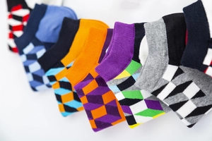 Detail view of cotton boat socks featuring 3D geometric square patterns in multi-color sets