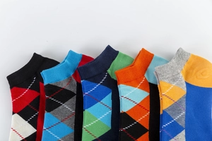 Detail of colorful Argyle pattern low-cut socks in soft cotton blend material