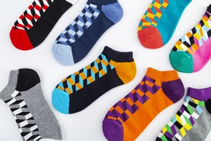 Detailed view of colorful 3D geometric patterns on cotton low-cut ankle socks for men