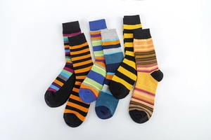 Detail of six pairs of vibrant multi-colored striped cotton socks with reinforced heels