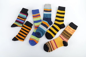 Detail of multi-colored striped cotton socks with ribbed cuffs and reinforced heels