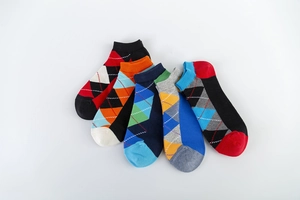 Detailed view of five pairs of argyle pattern knit cotton low-cut socks in vibrant colors