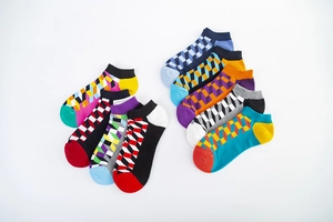 Detailed top view of 8 pairs of colorful geometric pattern low cut cotton socks for men
