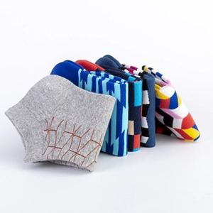 Men's low-cut cotton ankle socks featuring colorful geometric and striped patterns