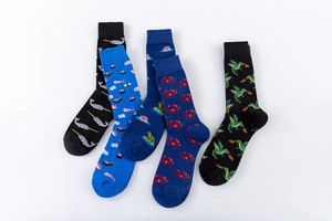 Flat lay of colorful cotton crew socks featuring animal and sushi knit patterns