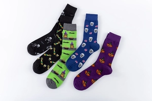 Detailed flat lay of Halloween crew socks featuring pumpkins, ghosts, and festive patterns