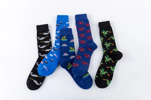 Close-up of five novelty crew socks featuring whale, sushi, frog, crab, and dragon patterns