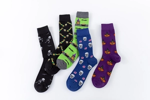 Detailed close-up of colorful Halloween crew socks with skeletons and pumpkin patterns