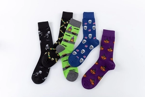 Detailed flat lay of five Halloween cotton socks featuring skulls, pumpkins and owls