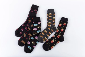 Flat lay of five novelty cotton crew socks featuring colorful fast food snacks patterns