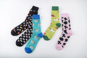 Close-up of five pairs of colorful cotton mid-calf socks with creative graphic patterns