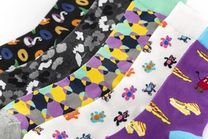 Detailed view of colorful cotton crew socks with various patterns including cartoon and geometric
