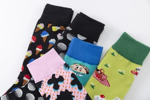 Flat lay of colorful cotton socks featuring ice cream, polka dots, and taco patterns