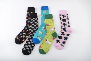 Detail of five assorted patterned cotton crew socks featuring ice cream and alpaca prints