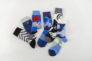 Flat lay of artistic cotton crew socks featuring Japanese waves and geometric patterns