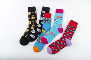 Detail of five pairs of cotton socks featuring guitar, tiger, and Rubik's cube patterns