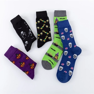 Five pairs of Halloween themed cotton crew socks with pumpkin and skull patterns