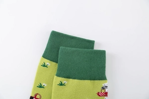 Detailed close-up of light green cotton crew sock with cute floral jacquard patterns