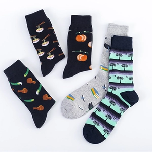 Five pairs of creative cotton crew socks with fun ramen and orange patterns on white background