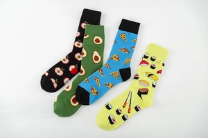 Flat lay of colorful cotton socks with vibrant apple, avocado, pizza and sushi patterns